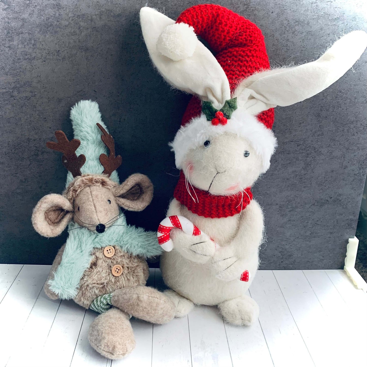 Large white festive rabbit with red hat and scarf sat next to Christmas mouse with antlers. Both from Wickerhearts Christmas gift collection.