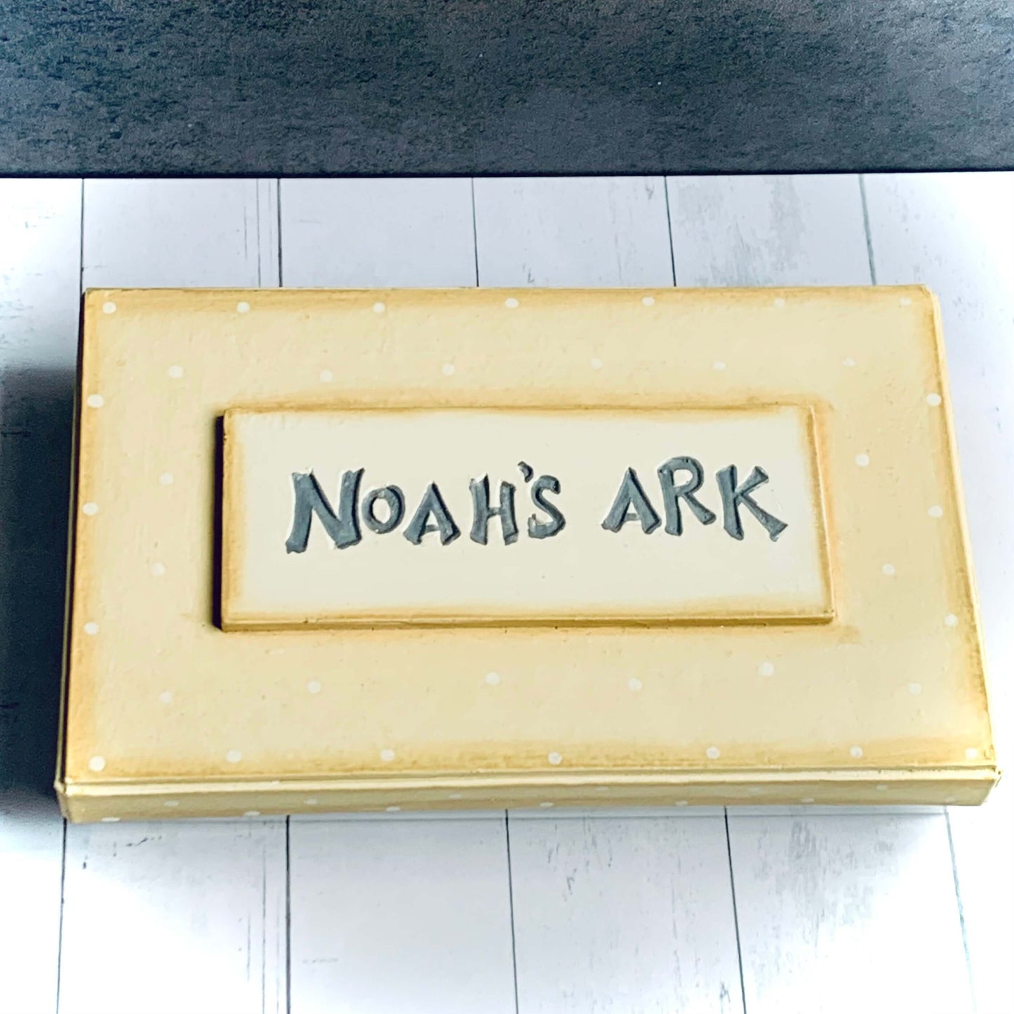 Image of boxed wooden Noah's Ark set with the lid closed and all pieces are inside. From Wickerhearts East of India gift ollection.