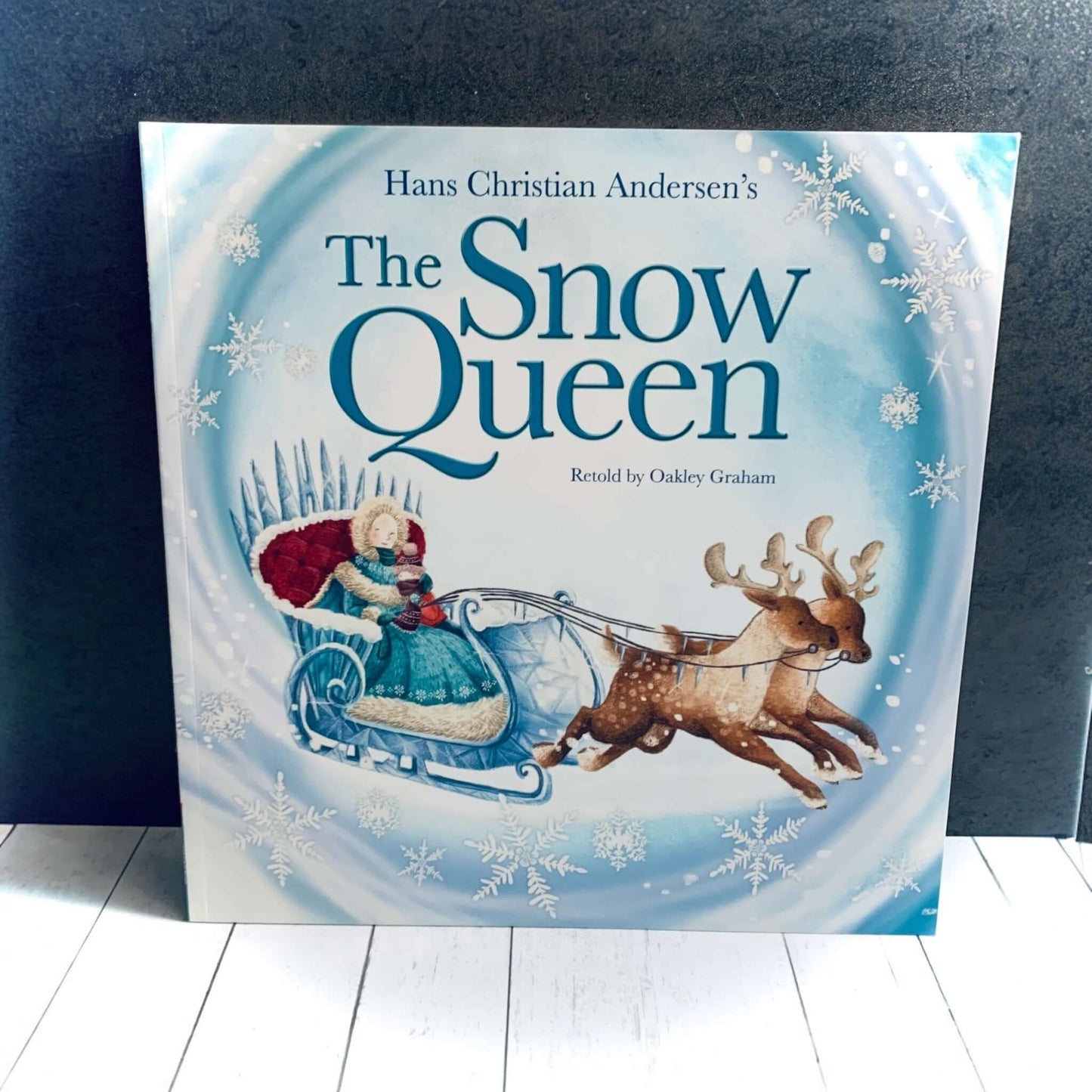 Illustraton of The Snow Queen on a sleigh with two reindeers for the front cover of this children's book. From Wickerhearts Christmas gift collection.