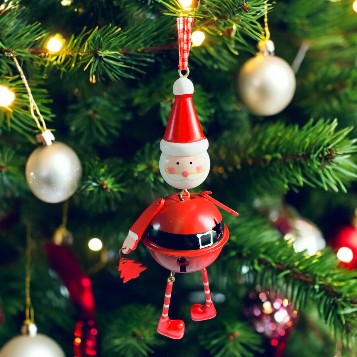 Santa character hanging bell, with moveable arms and legs. From Wickerhearts Christmas gift collection.