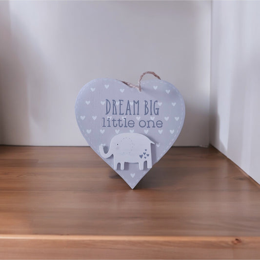 A grey wooden hanging heart adorned with a delightful elephant and the inspiring message 'Dream Big Little One' 
From Wickerhearts gift collecton.