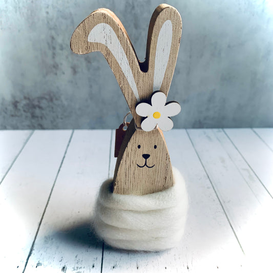 An Easter Wooden Bunny, Daisy is made from chunky wood and decorated with cream wool and daisy on head. From Wickerhearts Spring gift and decor collection.