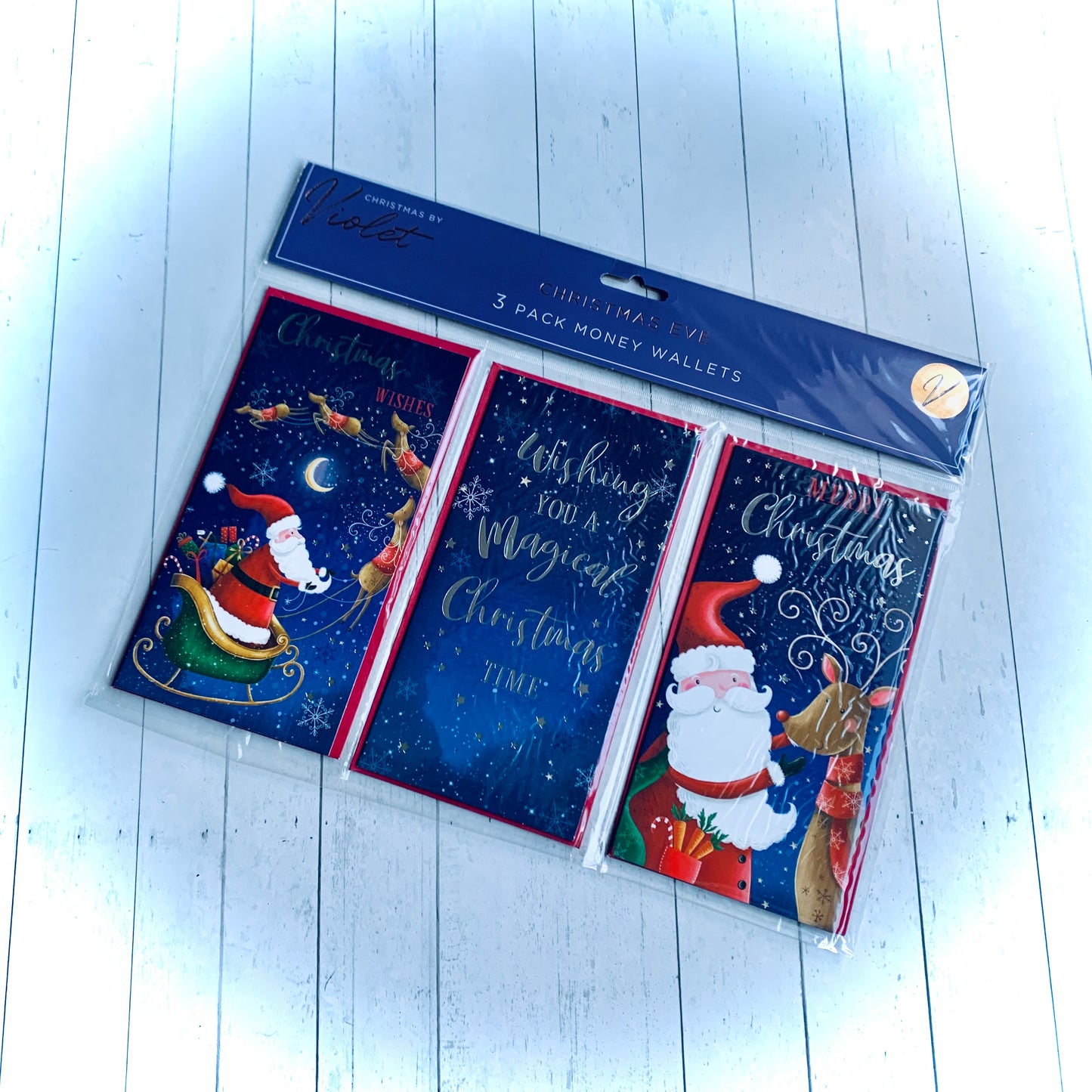 Wickerhearts Pack Of 3 blue and red money gift wallets and envelopes, with traditional Father Christmas and reindeer decoration. From the Christmas gift collection at Wickerhearts.