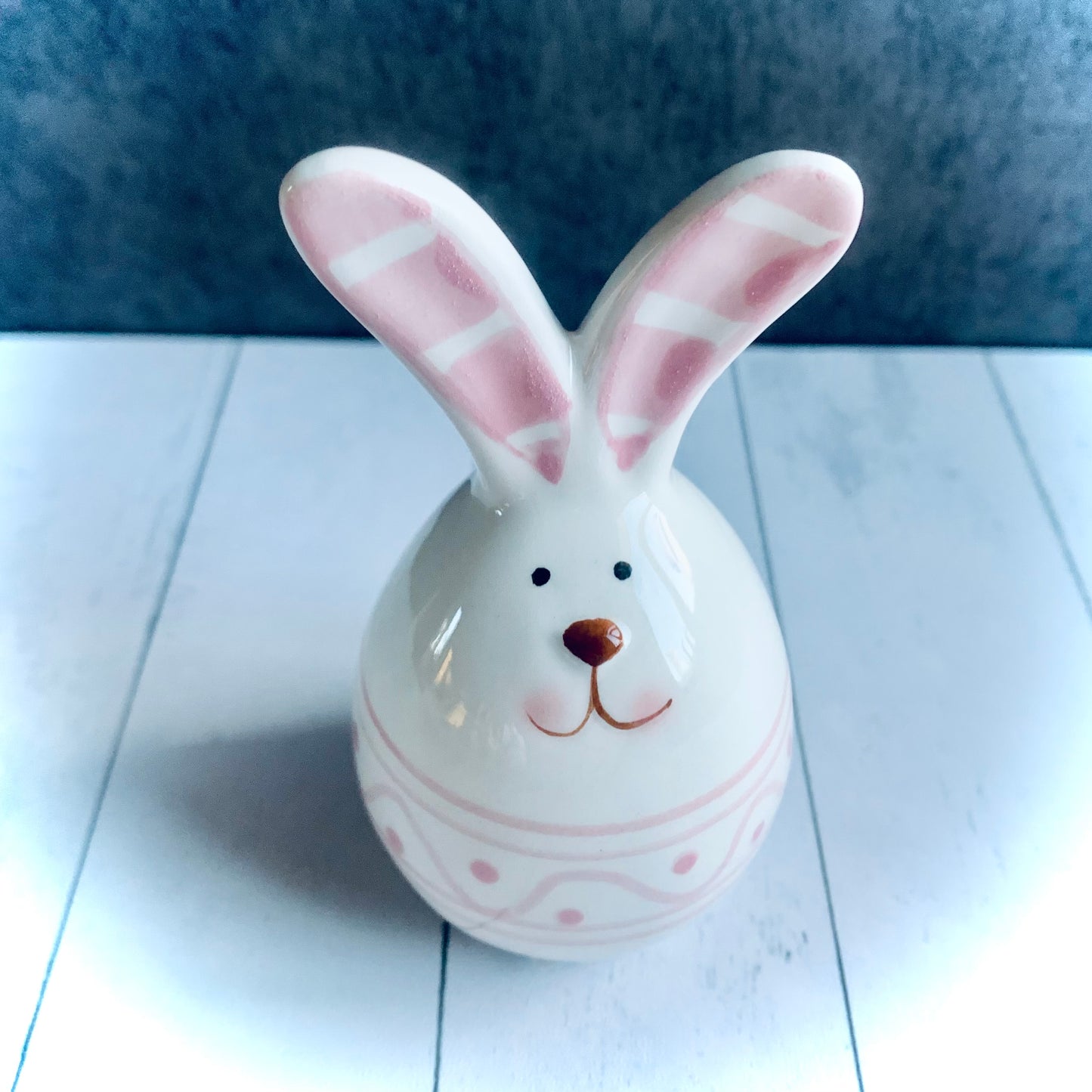 Pink and white ceramic bunny with pink stripey ears form the Spring 2024 gift collection at Wickerhearts.