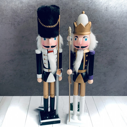 Two large black and gold Nutcracker Soldiers from Wickerhearts Christmas gift collection.