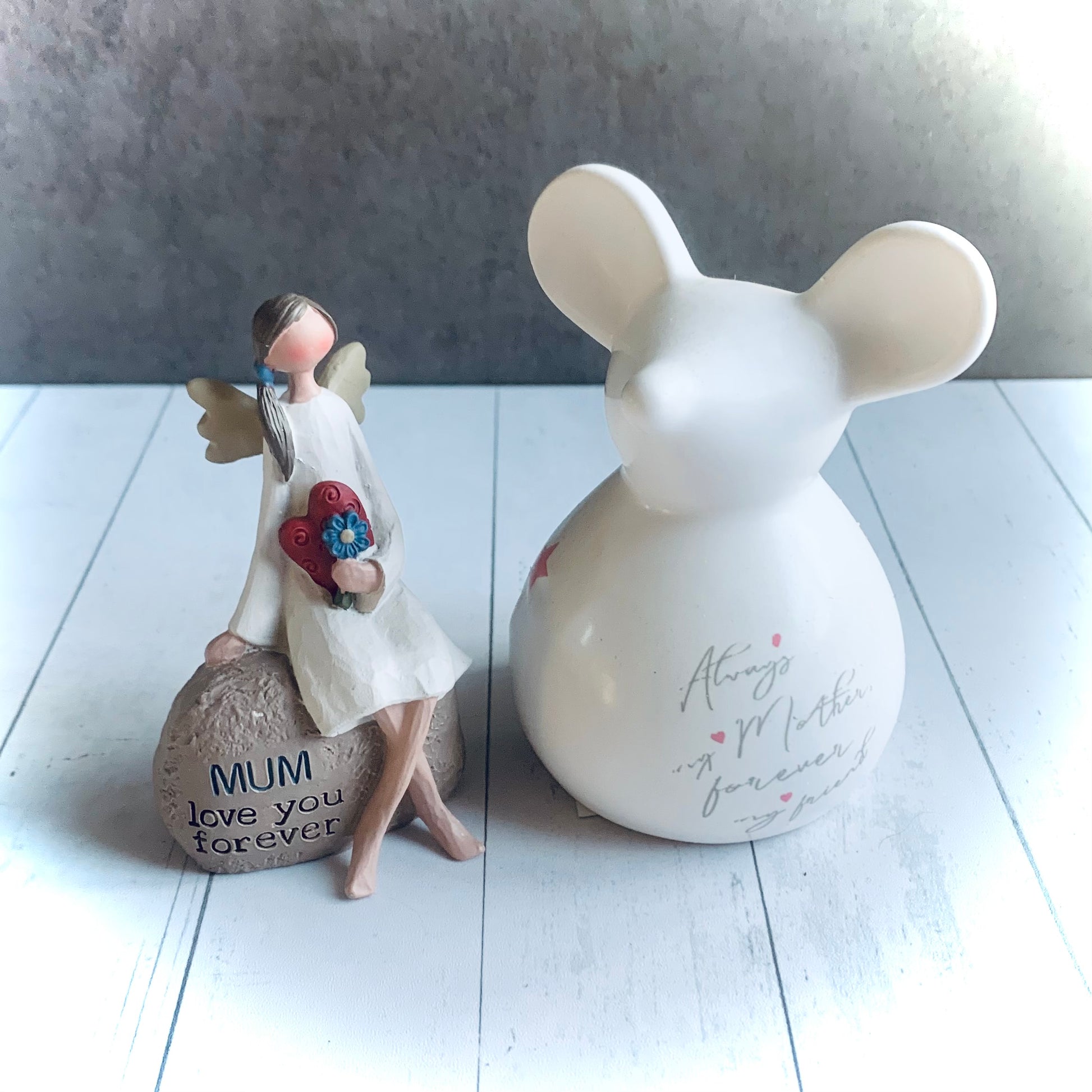 Image of white ceramic mouse next to resin girl sat on rock with mum quote. From Wickerhearts Spring and For Mum gift collection.