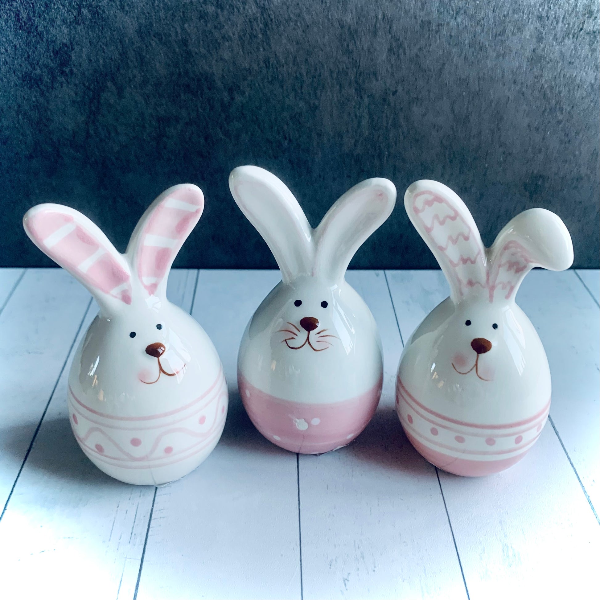 3 small pink and white ceramic bunnies for Easter decoration around your home. Sold individually from the Spring 2024 gift collection at Wickerhearts.