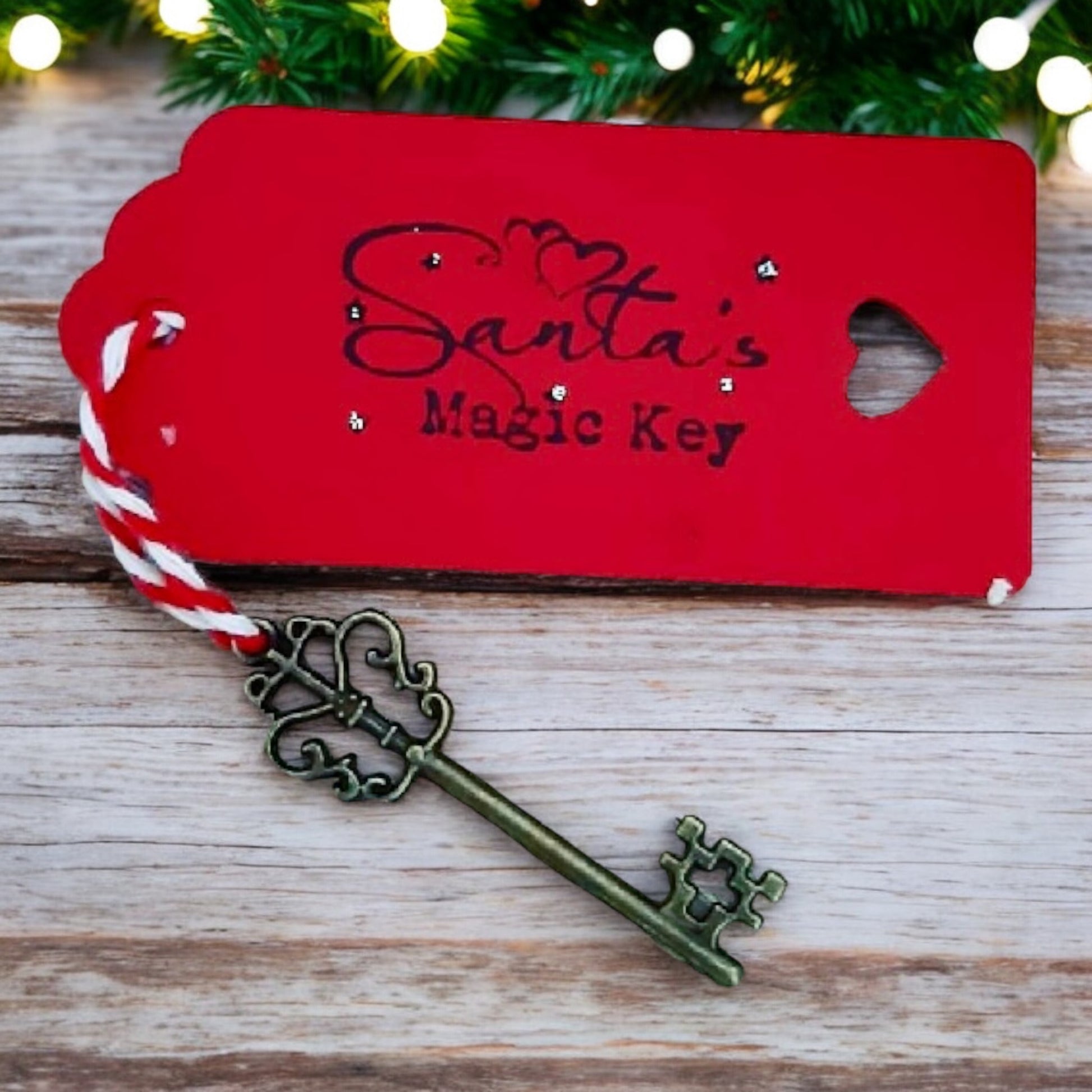 Santa's bronze Magic Key with red tag and red and white striped jute string. Part of Christmas Eve Surprise bundle. From Wickerhearts Christmas gift collection.