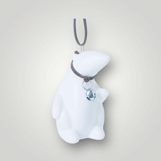 Image of small white ceramic polar bear with leather collar and bell, dangling from leather hanger. From Wickerhearts Christmas git collection.