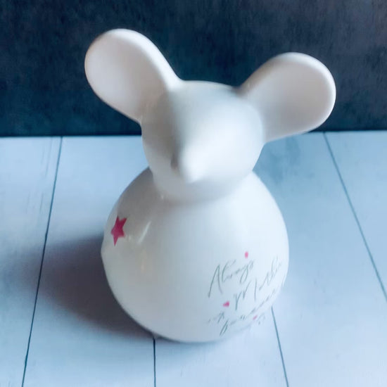 close up video of white ceramic mouse decor item. From Wickerhearts Spring and For Mum gift collection.